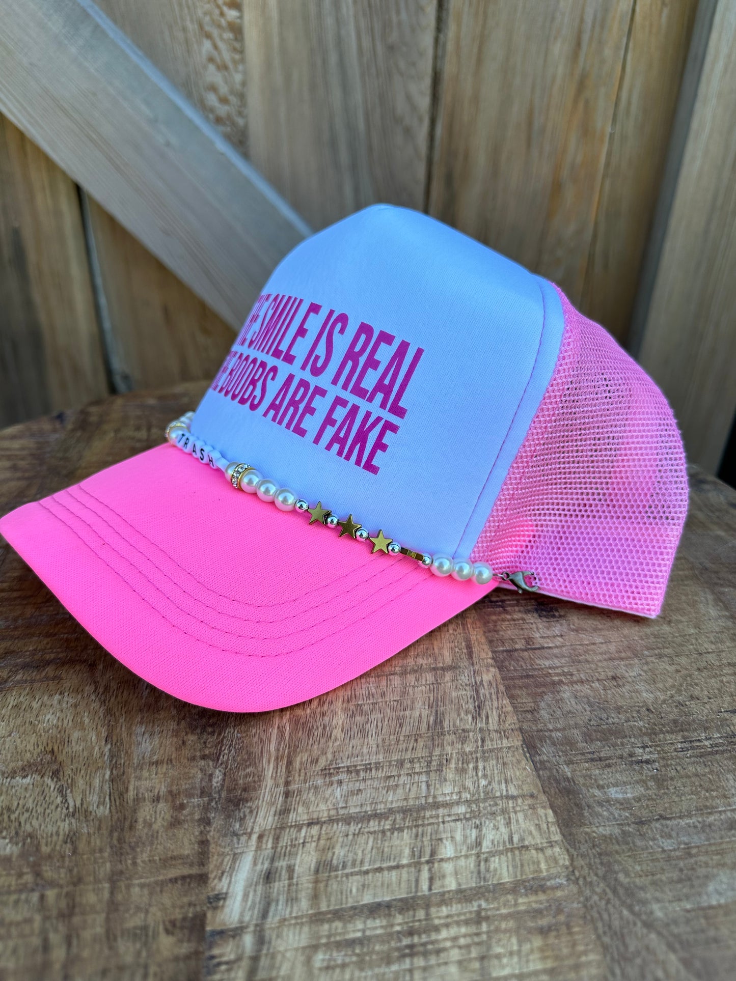 THE SMILE IS REAL TRUCKER HAT
