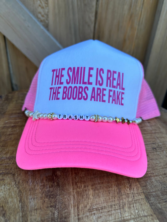 THE SMILE IS REAL TRUCKER HAT